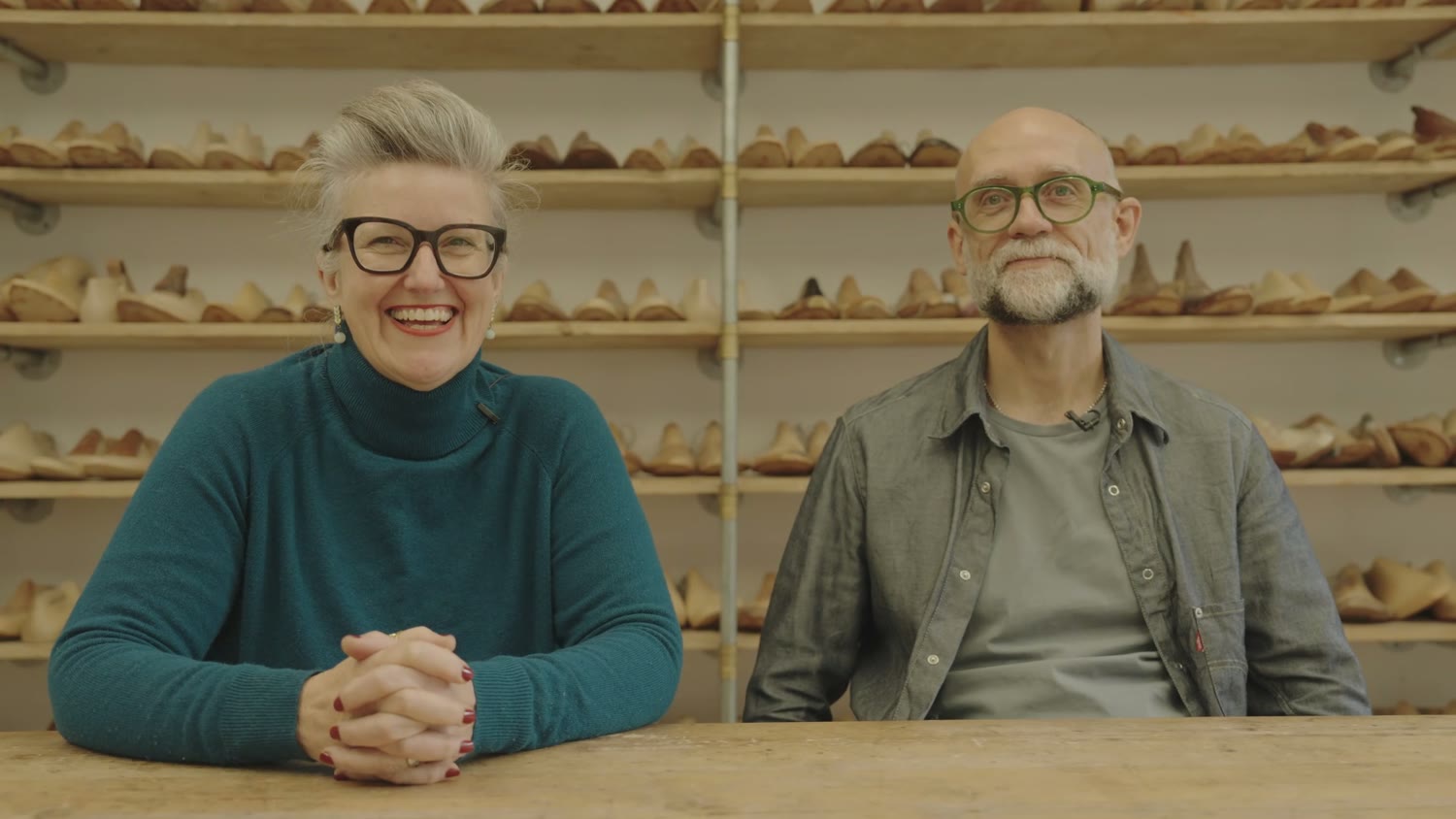 Deborah Carre and James Ducker laughing at the end of their interview in the workshop