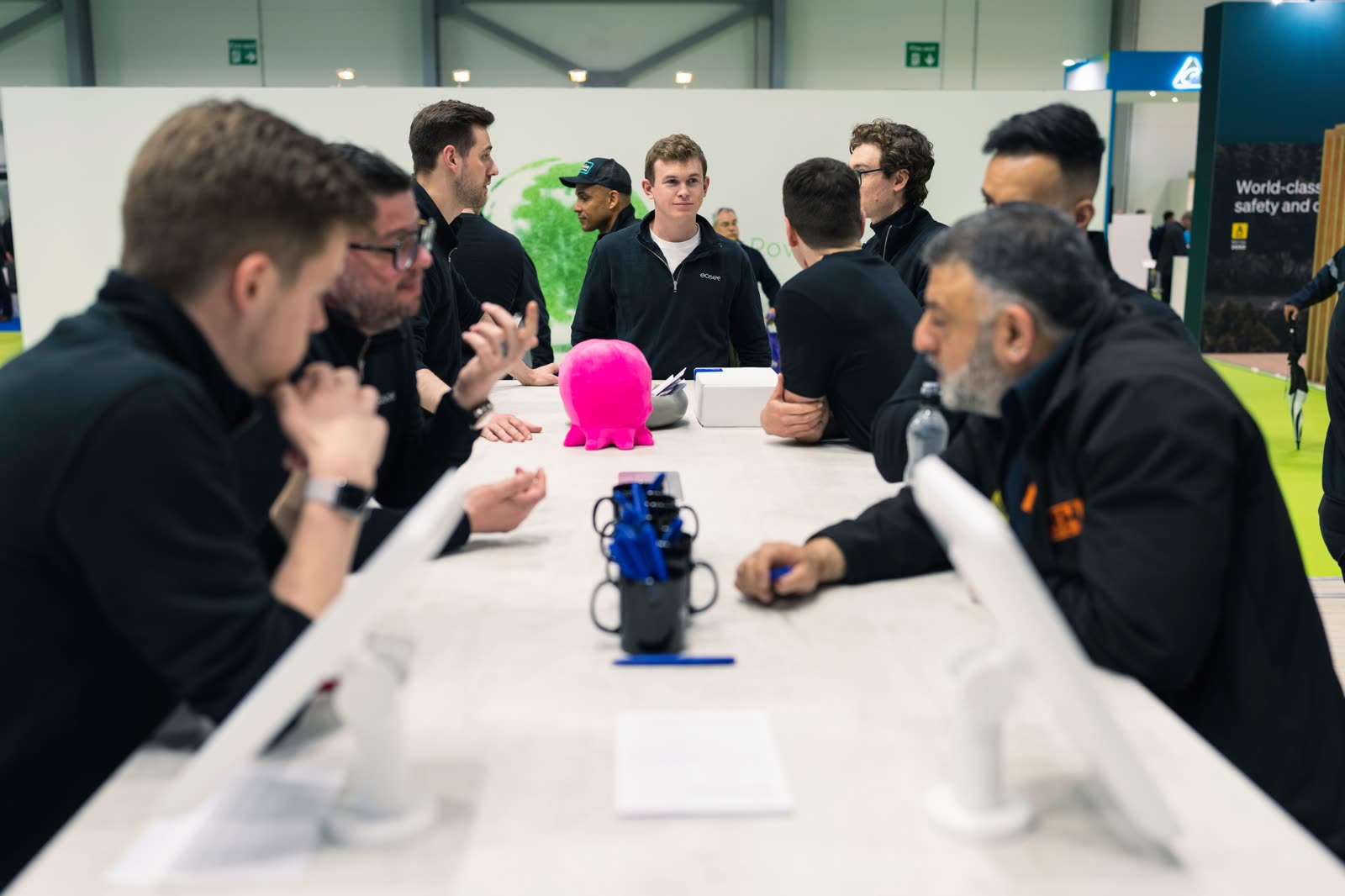 A team round a table talking through a shoot at the Fully Charged show