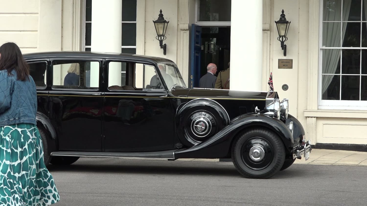 A vintage car outside a period building at Southwick, filmed for the D-Day 80 anniversary