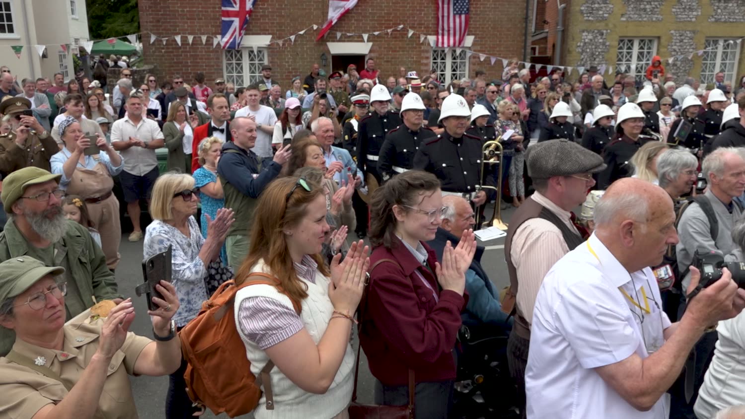 A crowd applauding at the Southwick D-Day 80 commemoration