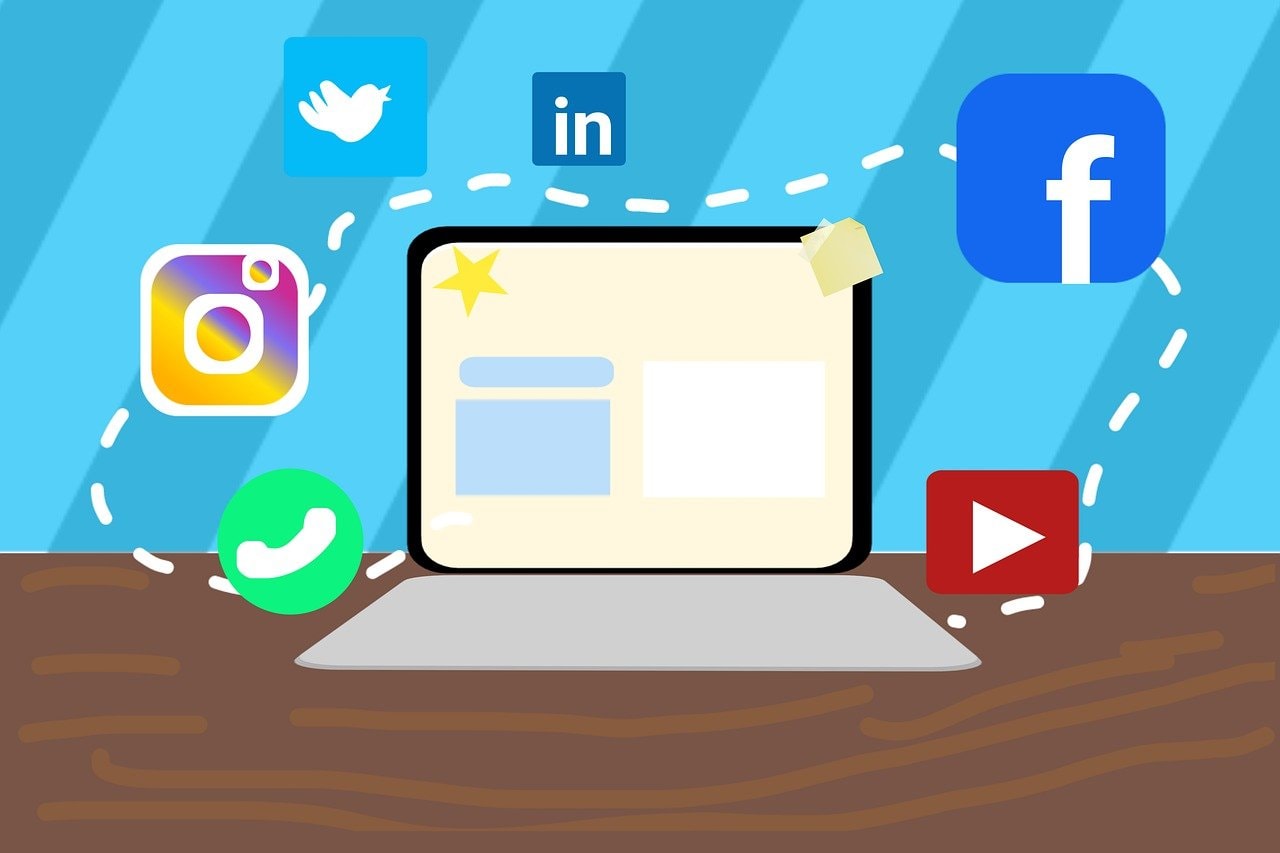 Illustration of a laptop with social media icons including Instagram, WhatsApp, Twitter, LinkedIn, Facebook, and YouTube